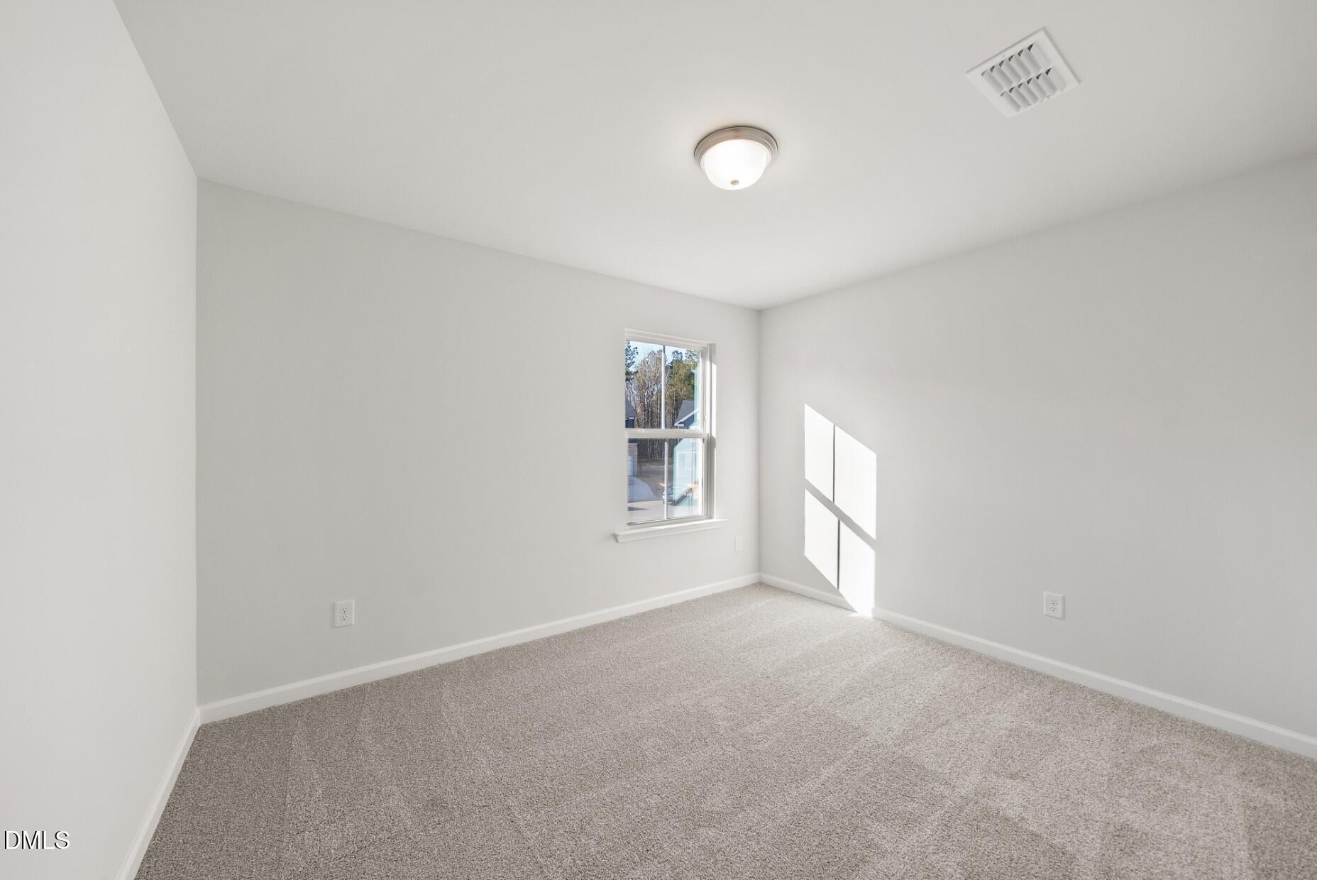 213 Bridle Brk Way Fuquay-Varina, NC 27526 - Photo 19 of 25 a view of an empty room with a window