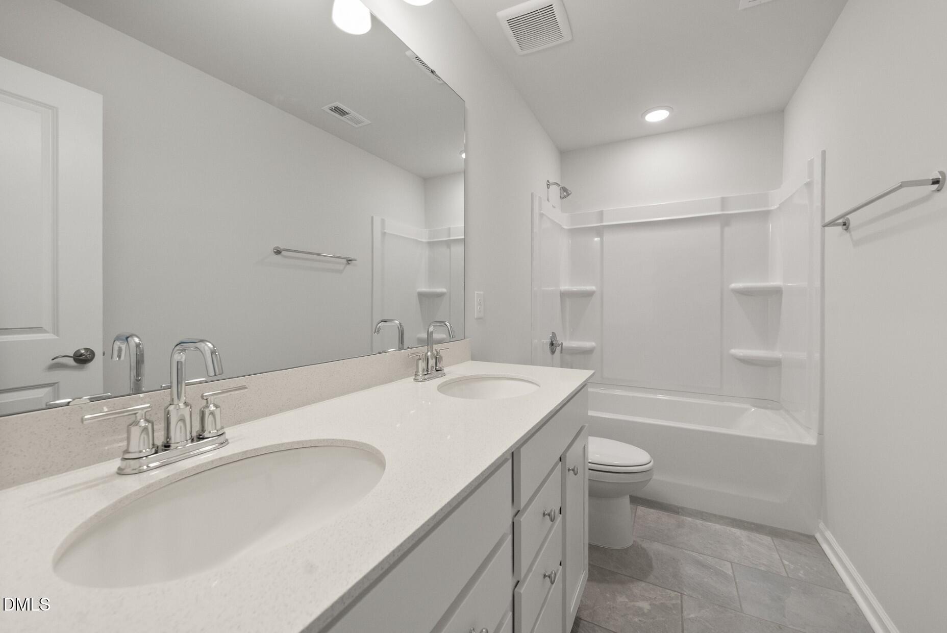 213 Bridle Brk Way Fuquay-Varina, NC 27526 - Photo 22 of 25 a bathroom with a sink a toilet and shower