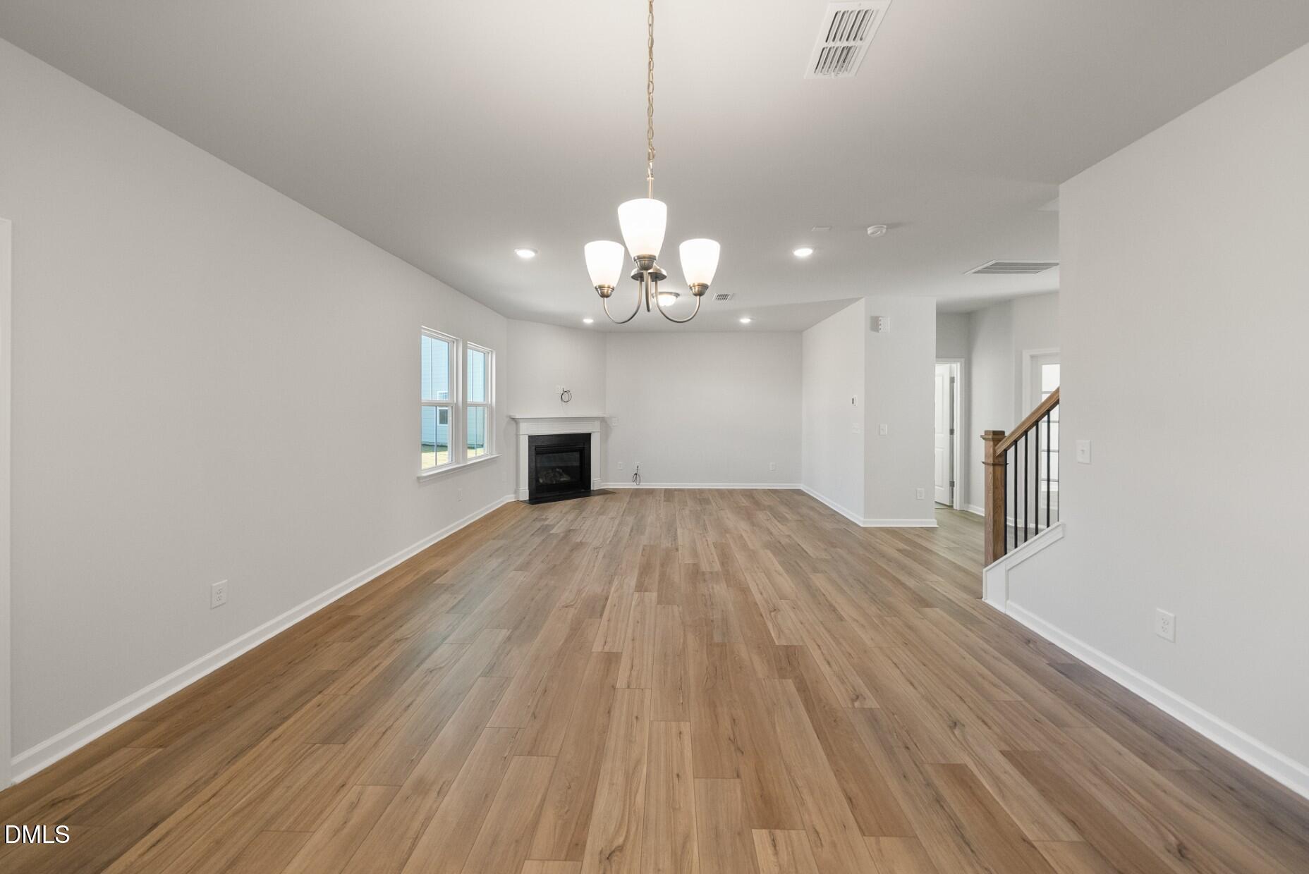 213 Bridle Brk Way Fuquay-Varina, NC 27526 - Photo 7 of 25 a view of a livingroom with a chandelier