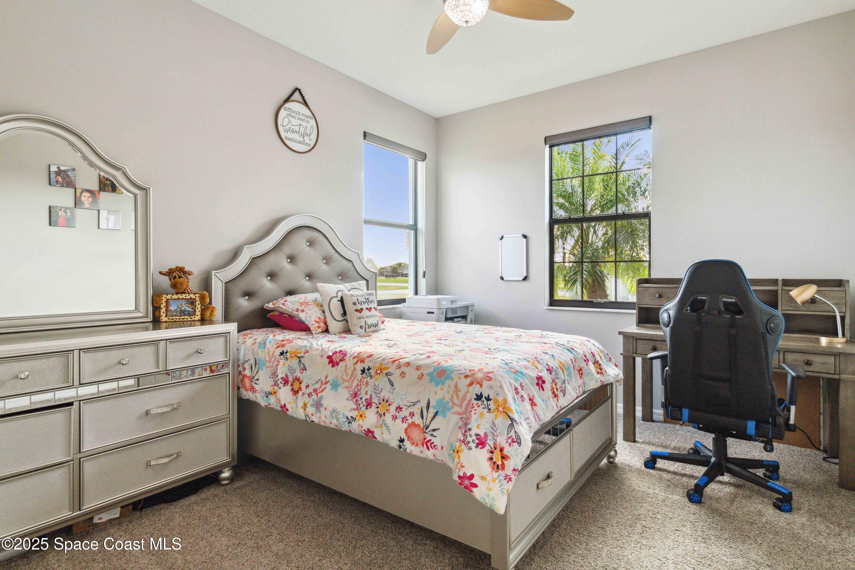 7565 Millbrook Avenue Melbourne, FL 32940 - Photo 20 of 47 a bedroom with bed and a window