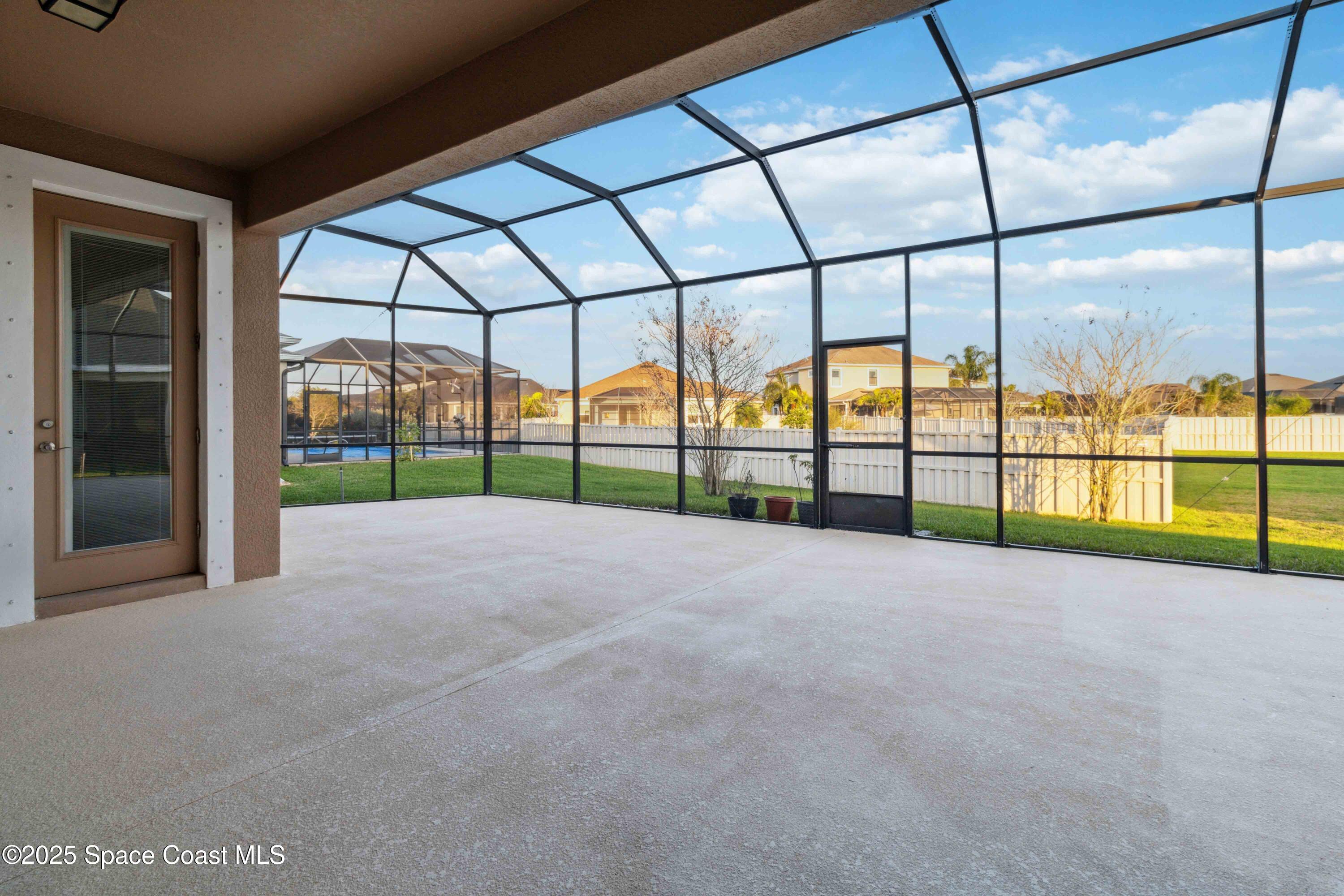 7565 Millbrook Avenue Melbourne, FL 32940 - Photo 29 of 47 a view of a house and a big room