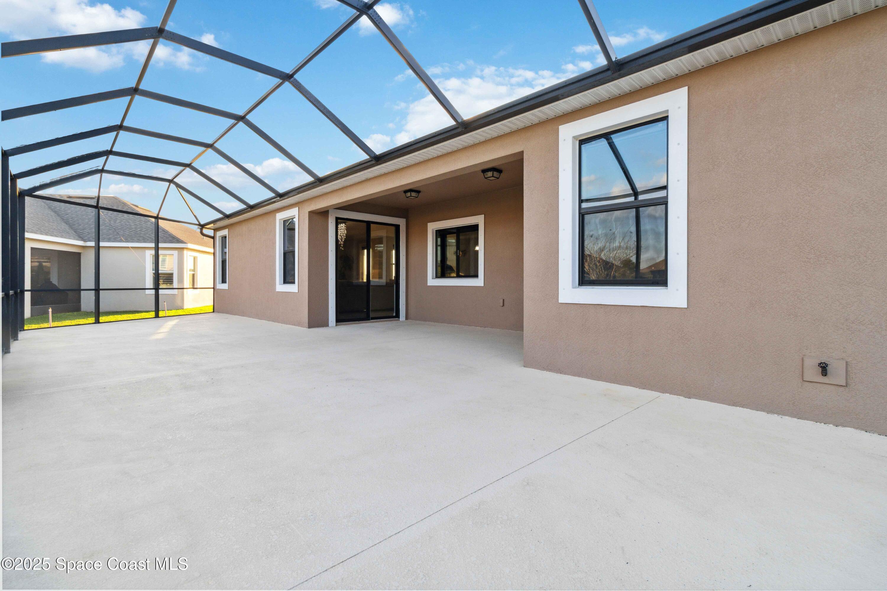 7565 Millbrook Avenue Melbourne, FL 32940 - Photo 30 of 47 a view of a house with a porch