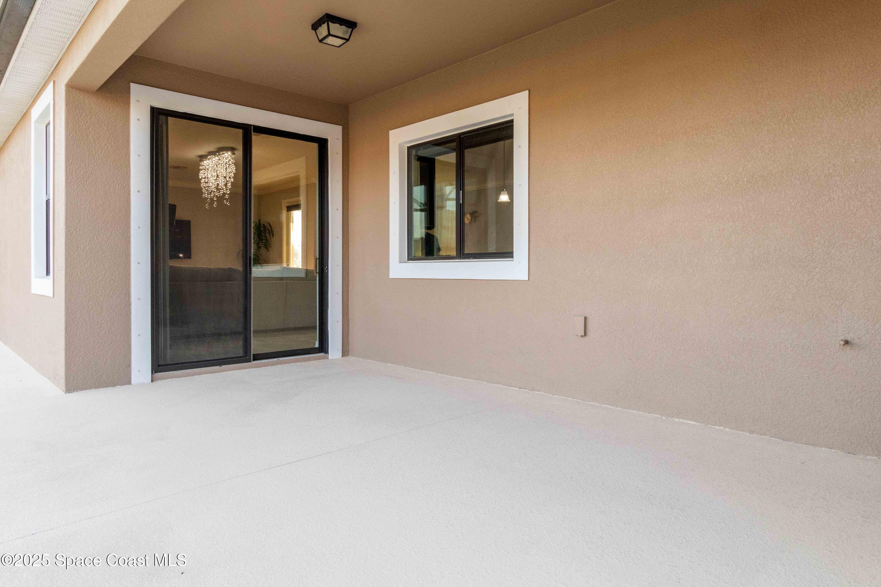 7565 Millbrook Avenue Melbourne, FL 32940 - Photo 31 of 47 a view of an empty room with closet and a window