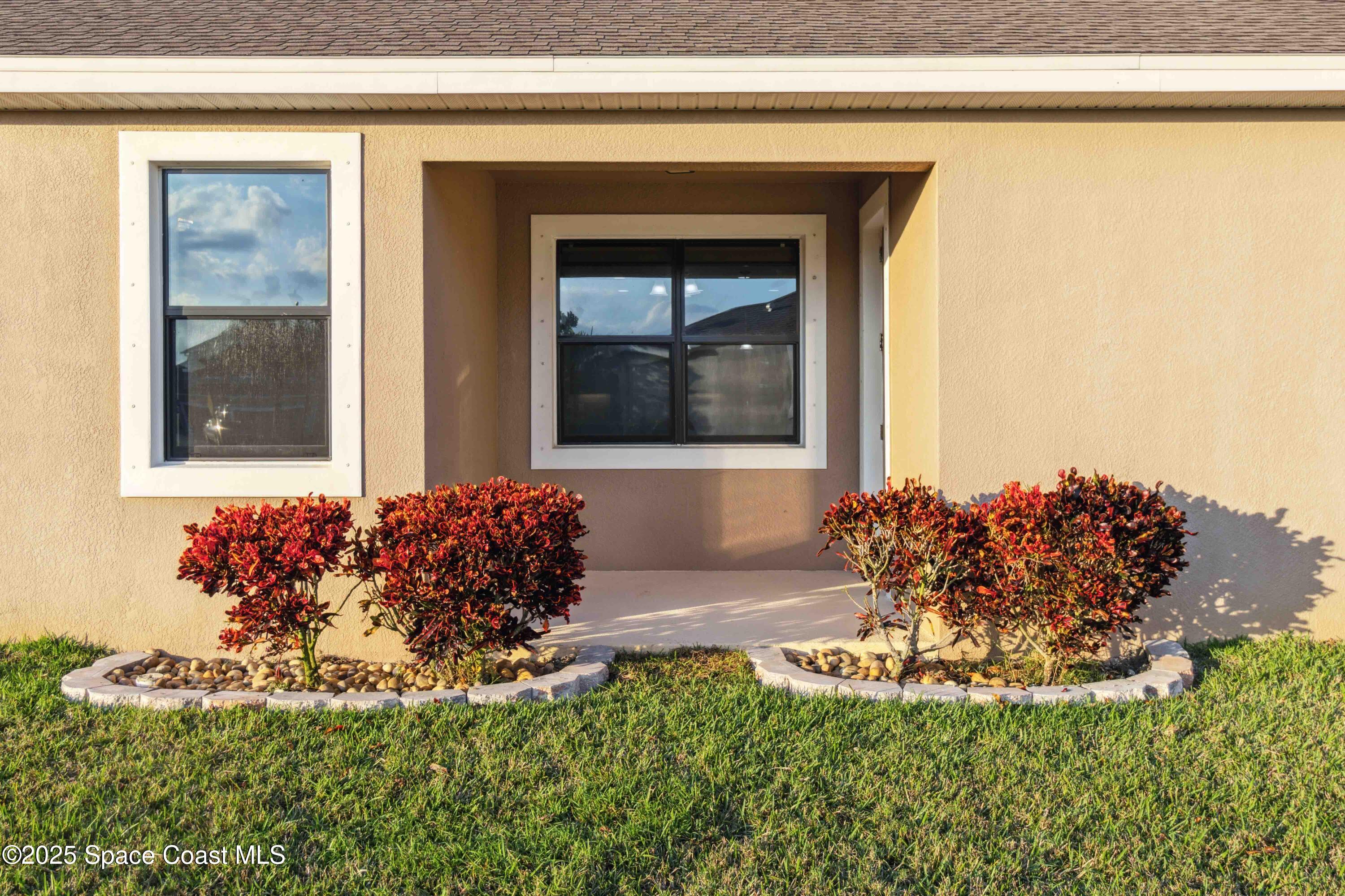 7565 Millbrook Avenue Melbourne, FL 32940 - Photo 32 of 47 a front view of a house