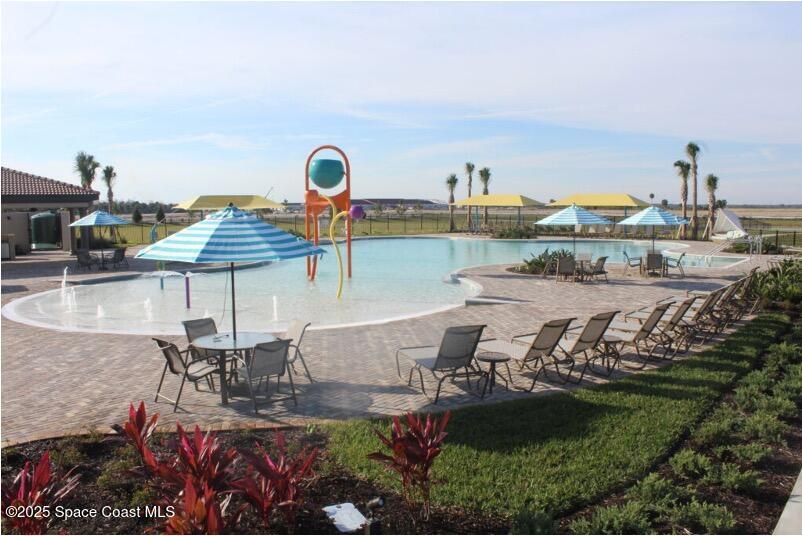 7565 Millbrook Avenue Melbourne, FL 32940 - Photo 39 of 47 a view of swimming pool with outdoor seating