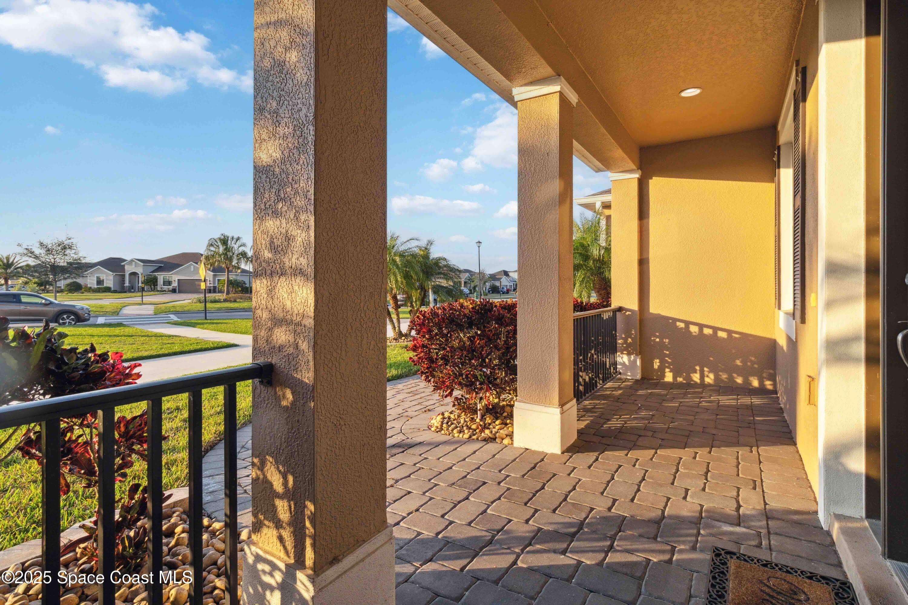 7565 Millbrook Avenue Melbourne, FL 32940 - Photo 4 of 47 a view of a balcony with city view
