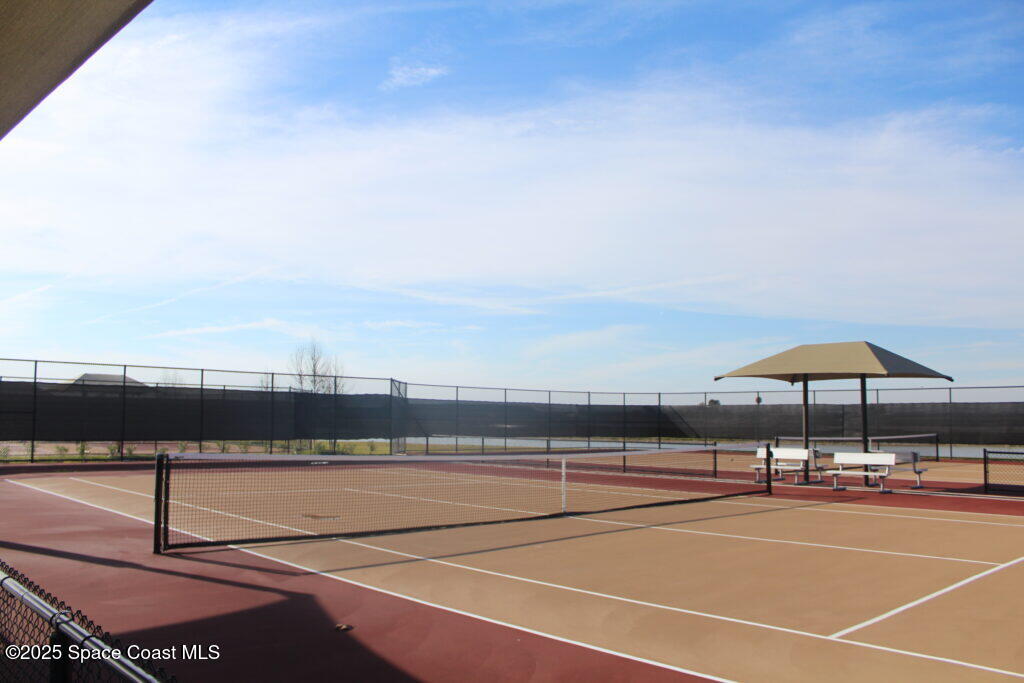 7565 Millbrook Avenue Melbourne, FL 32940 - Photo 45 of 47 a view of tennis court with seating area