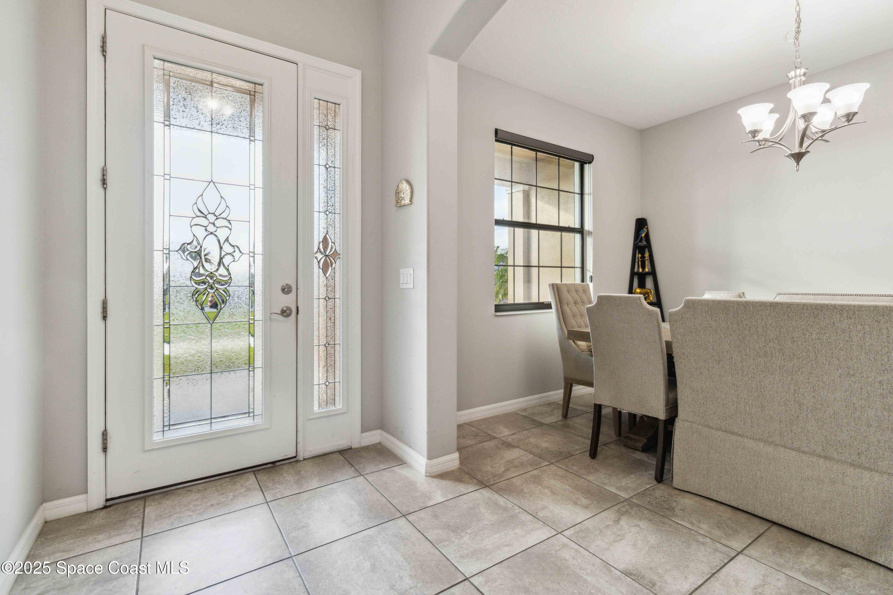 7565 Millbrook Avenue Melbourne, FL 32940 - Photo 5 of 47 a view of a room with windows and cabinet