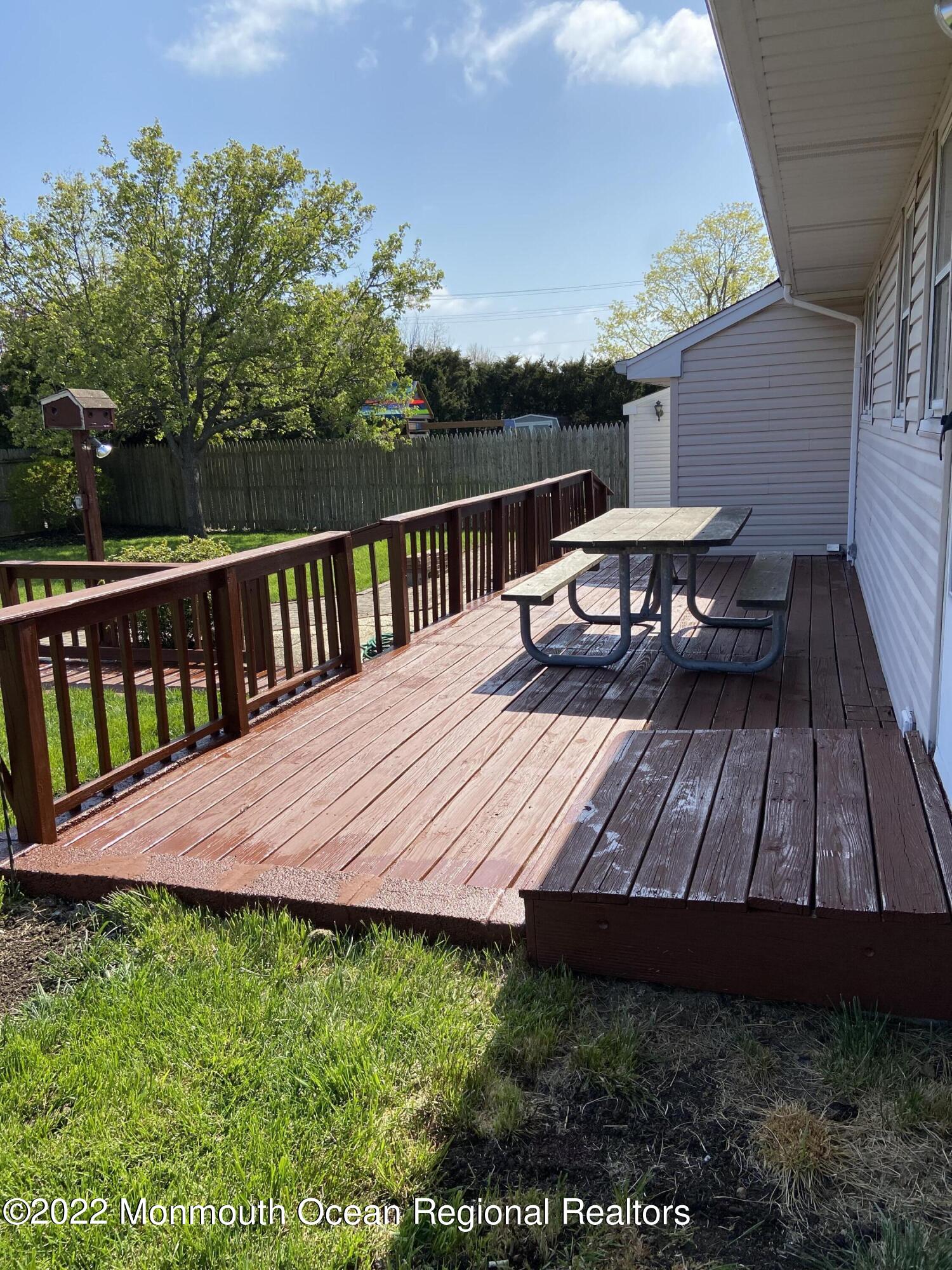 605 Adamston Road Brick, NJ 08723 - Photo 11 of 16 a view of a wooden deck and yard