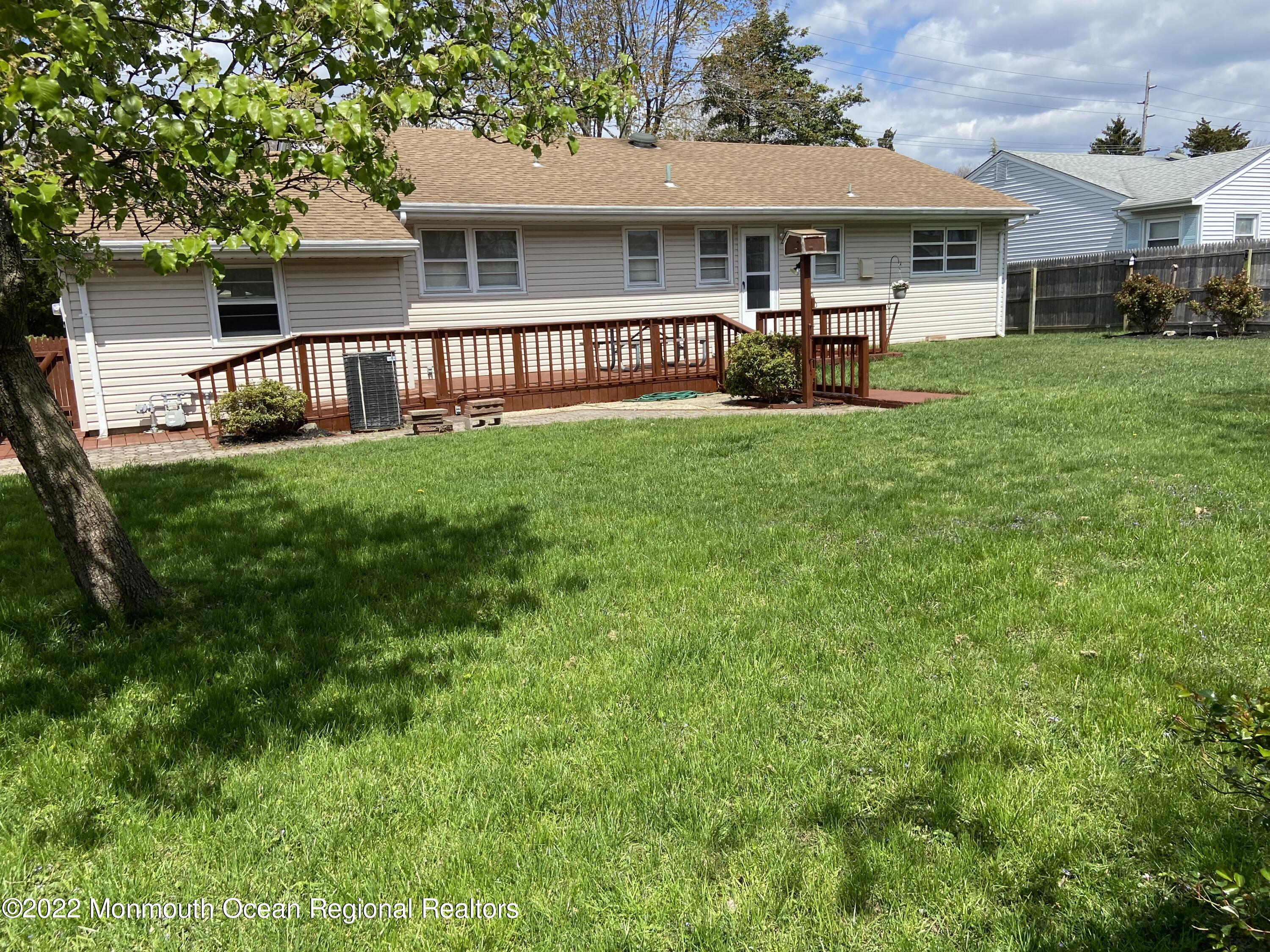 605 Adamston Road Brick, NJ 08723 - Photo 12 of 16 a front view of house with yard and outdoor seating