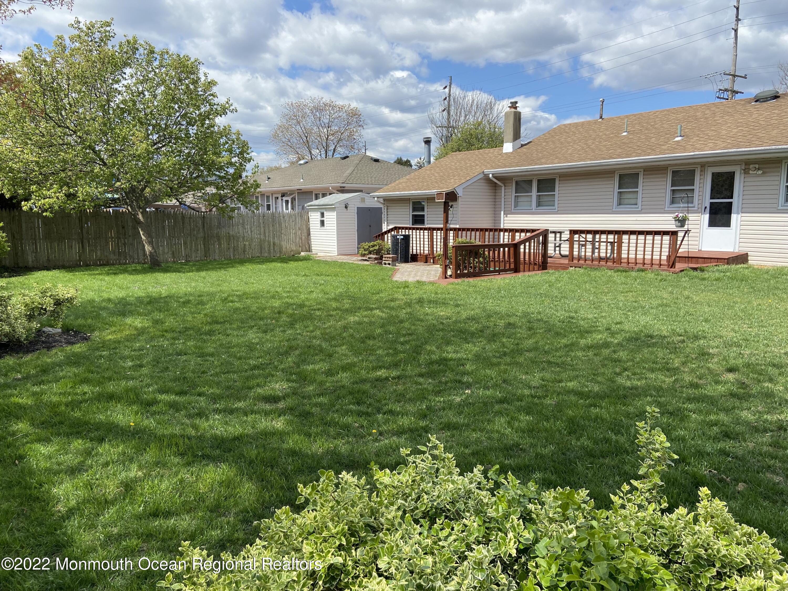 605 Adamston Road Brick, NJ 08723 - Photo 13 of 16 a view of a house with pool and garden