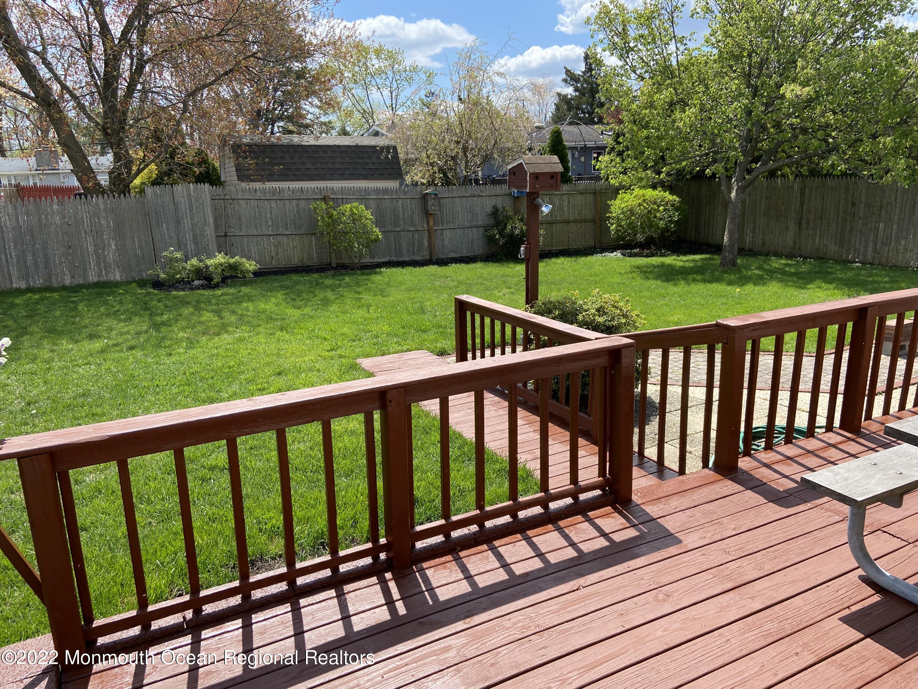 605 Adamston Road Brick, NJ 08723 - Photo 15 of 16 a view of a deck with a yard
