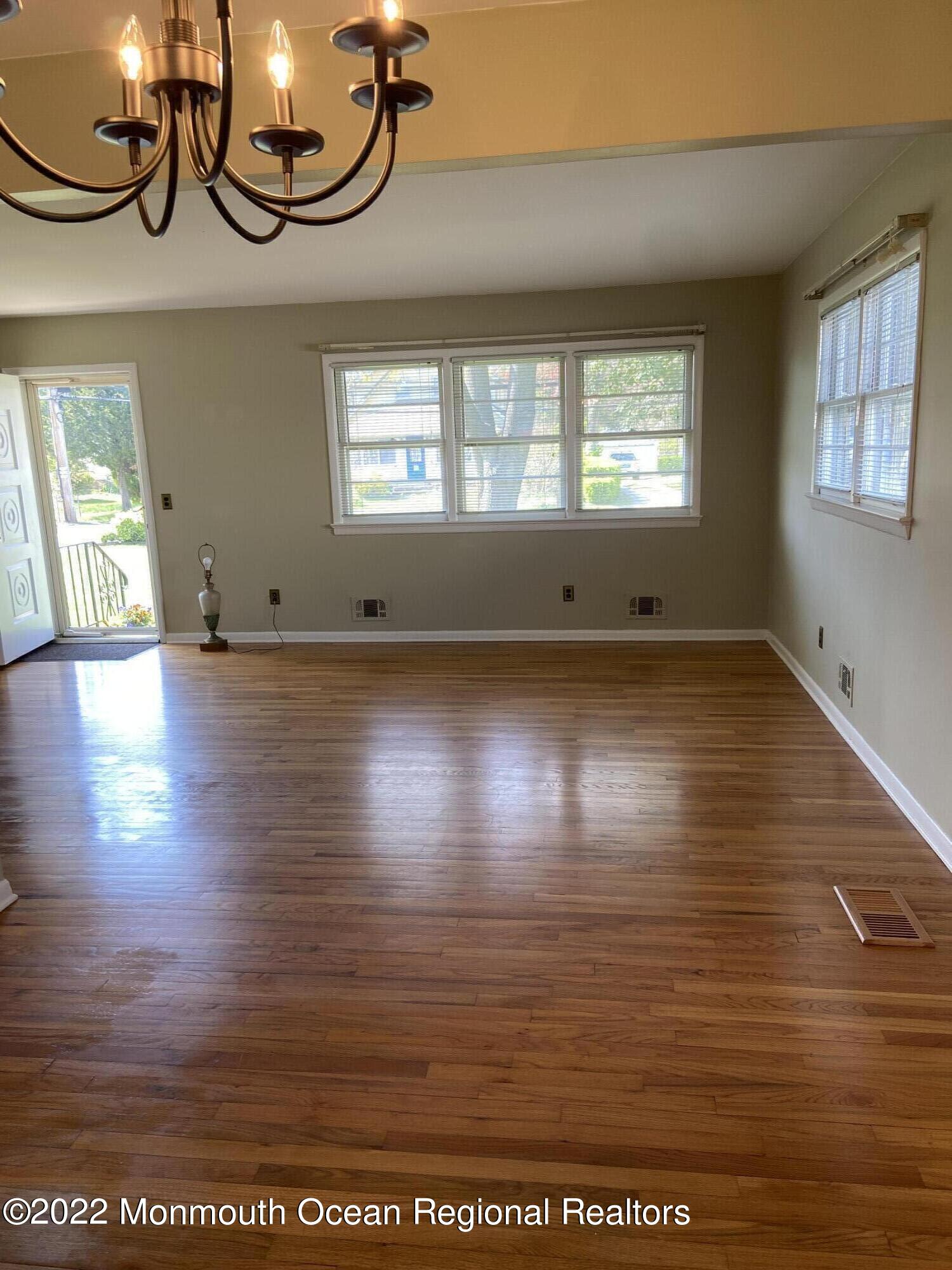 605 Adamston Road Brick, NJ 08723 - Photo 4 of 16 a view of room with window and wooden floor