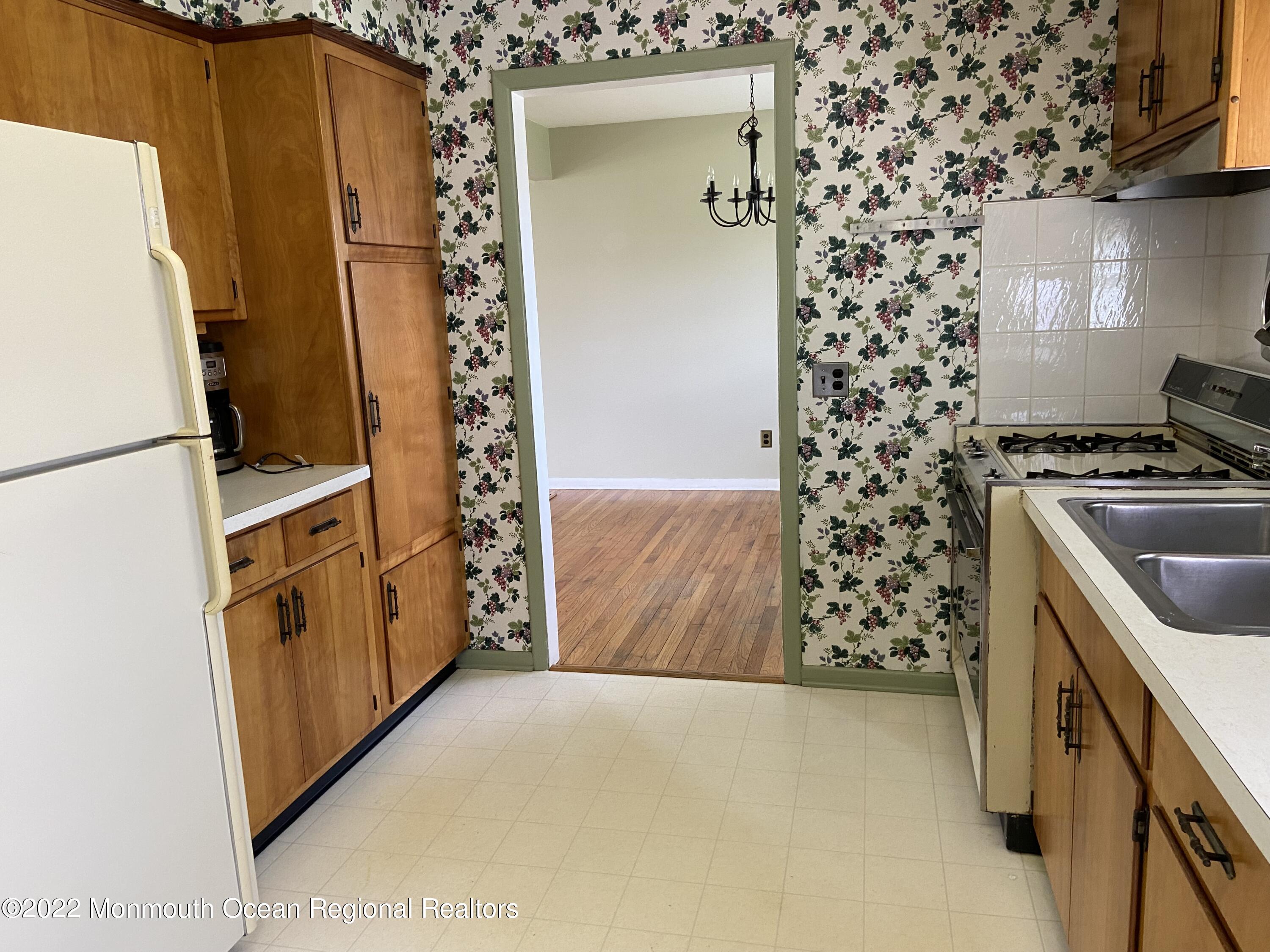 605 Adamston Road Brick, NJ 08723 - Photo 9 of 16 a kitchen with a refrigerator and a stove