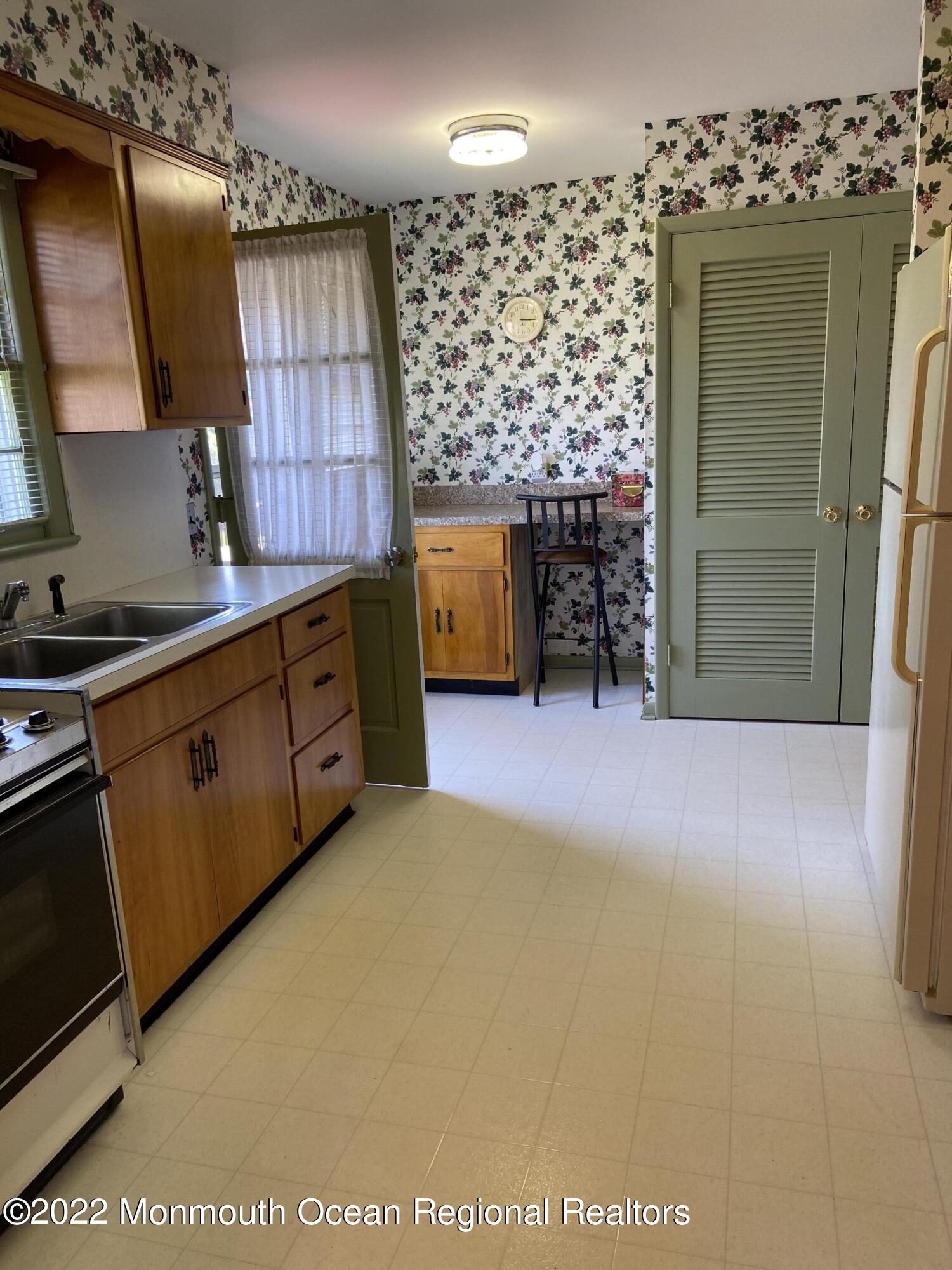 605 Adamston Road Brick, NJ 08723 - Photo 10 of 16 a kitchen with a sink and cabinets