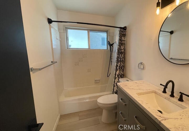 7428 Acoma Trail Yucca Valley, CA 92284 - Photo 11 of 18 a bathroom with a granite countertop sink toilet and shower