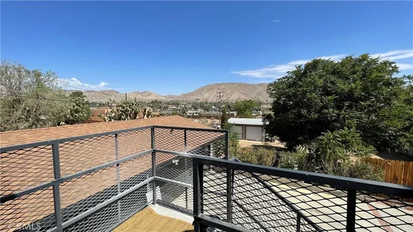 a view of an empty room with a bathroom