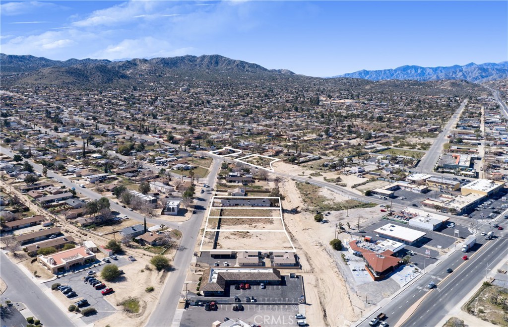 7428 Acoma Trail Yucca Valley, CA 92284 - Photo 18 of 18 an aerial view of residential houses with city view