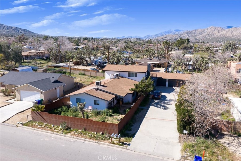 7428 Acoma Trail Yucca Valley, CA 92284 - Photo 6 of 18 a view of a city with tall buildings
