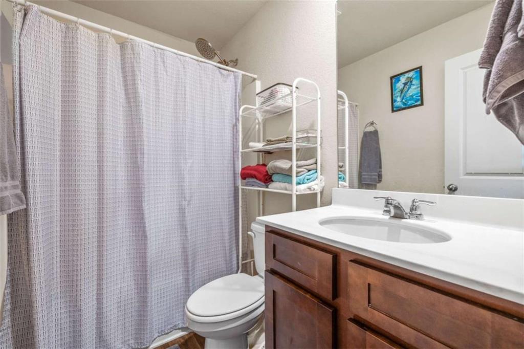 306 Seasons Valley Pendergrass, GA 30567 - Photo 24 of 37 a bathroom with a sink and a mirror