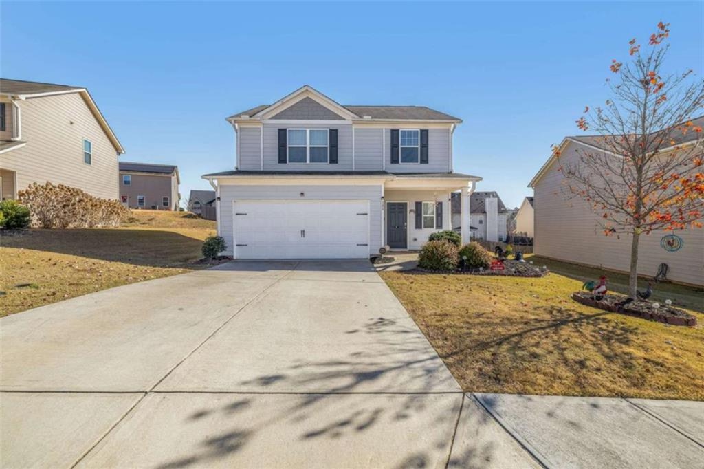 306 Seasons Valley Pendergrass, GA 30567 - Photo 3 of 37 a front view of a house with a yard
