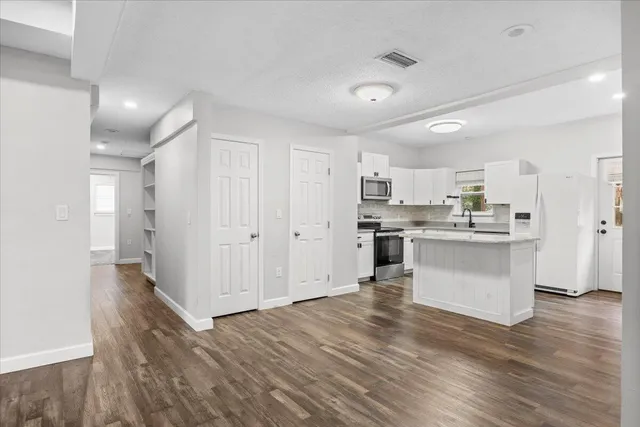 a view of kitchen with wooden floor