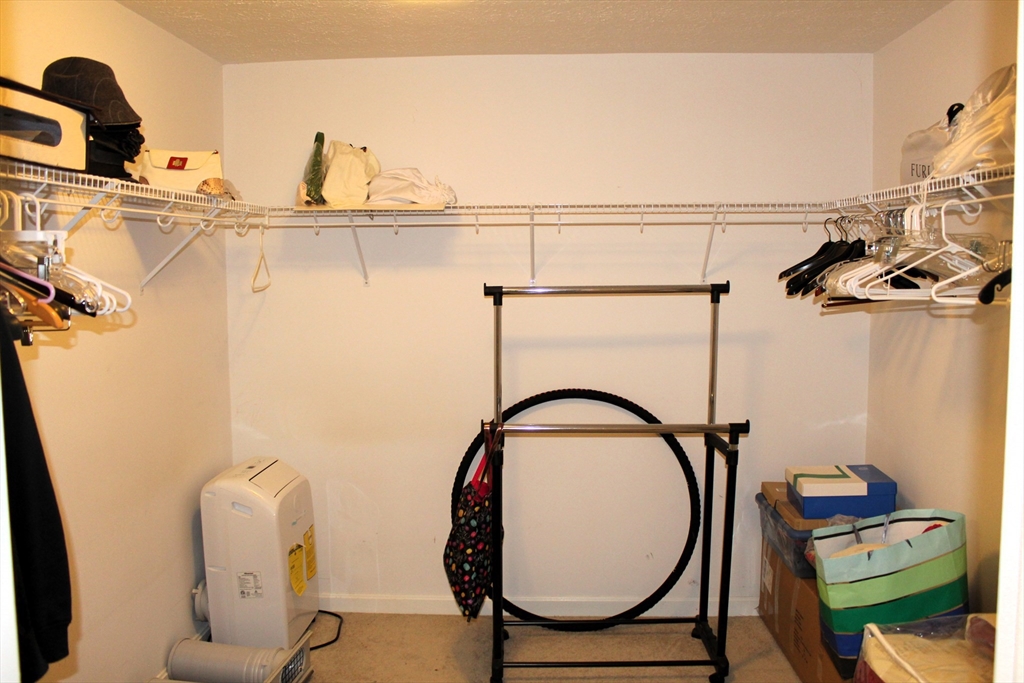 38 Georgetown Drive, Unit 38 Nashua, NH 03062 - Photo 17 of 26 a bathroom with a sink mirror and vanity