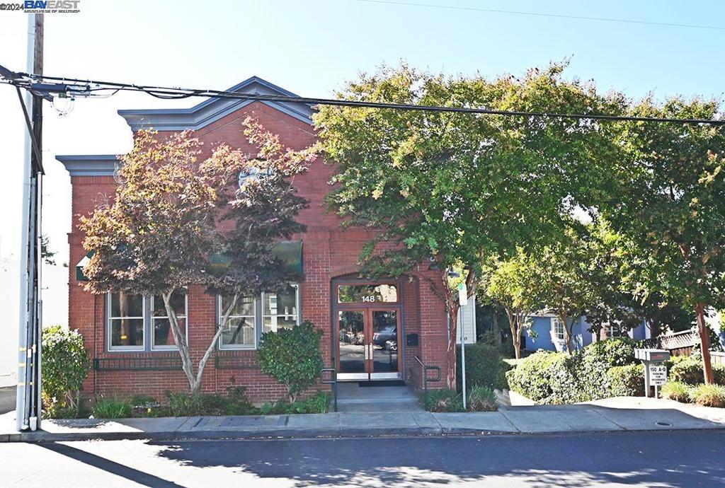 148 Spring Street Pleasanton, CA 94566 - Photo 2 of 46 front view of a house with a tree