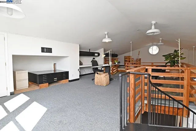 a roof deck with dining table and chairs