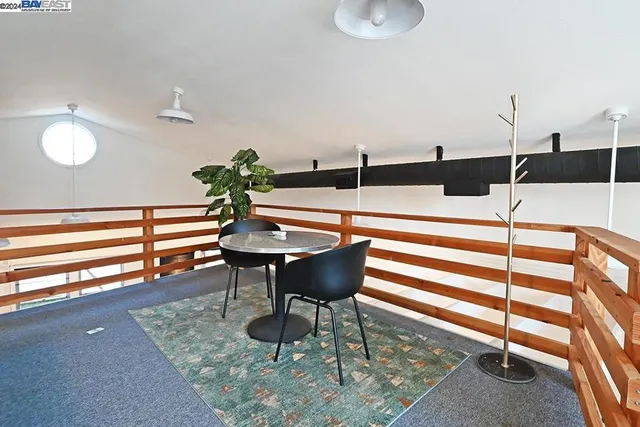 a bedroom with furniture and white walls