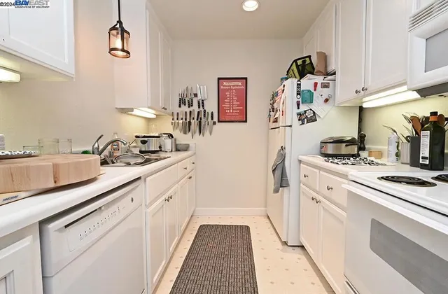 a bathroom with a sink a toilet and a shower