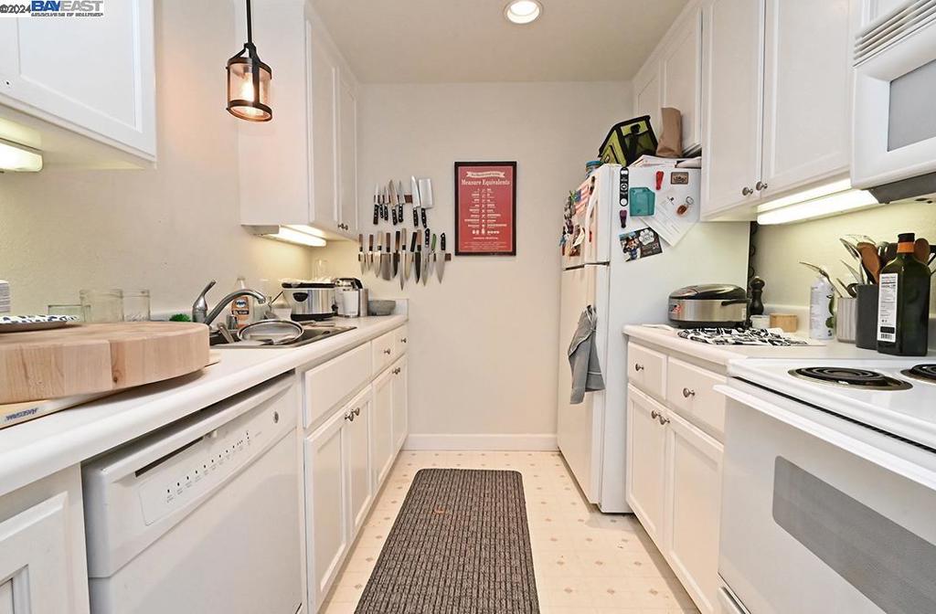 148 Spring Street Pleasanton, CA 94566 - Photo 27 of 46 a kitchen with a sink and cabinets