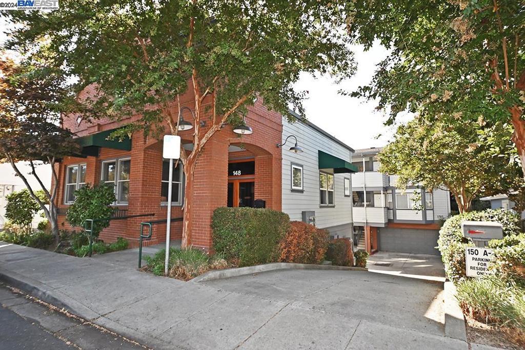 148 Spring Street Pleasanton, CA 94566 - Photo 3 of 46 a front view of a house with a garden