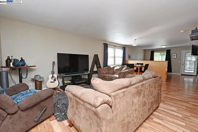 a kitchen with stainless steel appliances a sink stove and refrigerator
