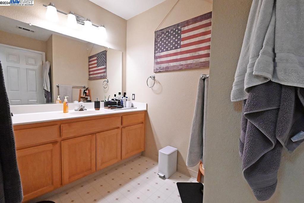 148 Spring Street Pleasanton, CA 94566 - Photo 34 of 46 a bathroom with a sink a toilet and a mirror