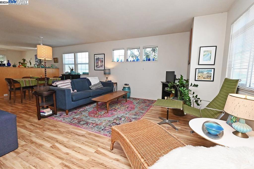 148 Spring Street Pleasanton, CA 94566 - Photo 39 of 46 a living room with furniture hard wood floor and a table
