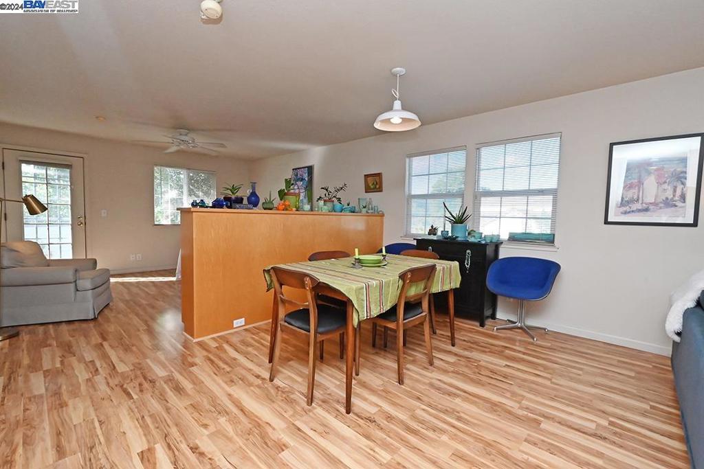 148 Spring Street Pleasanton, CA 94566 - Photo 42 of 46 a view of a dining room with furniture and wooden floor