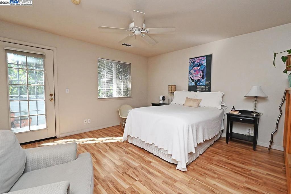 148 Spring Street Pleasanton, CA 94566 - Photo 43 of 46 a spacious bedroom with a bed and wooden floor