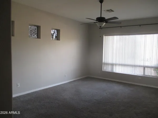 a view of empty room with windows