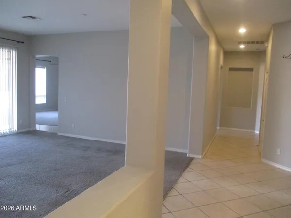 a view of empty room with a fireplace