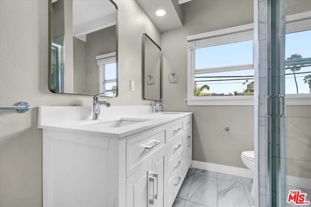 a kitchen with a sink and a washer dryer