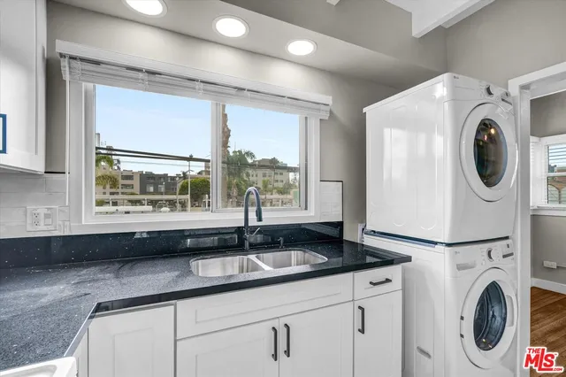 a kitchen with appliances and cabinets