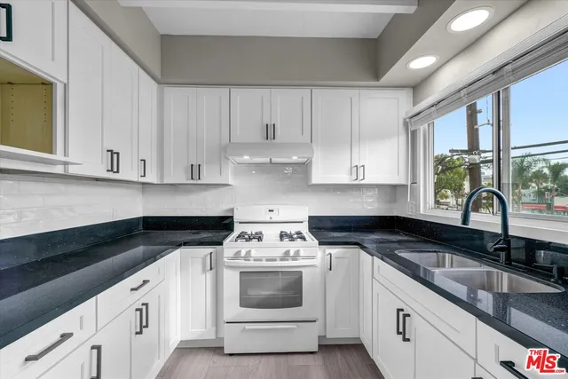 a kitchen with a washer and dryer