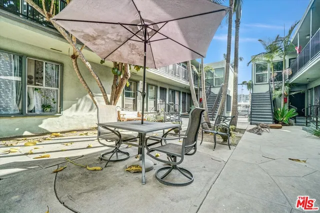an empty room with sliding door and windows