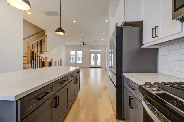 a kitchen with a stove and a sink