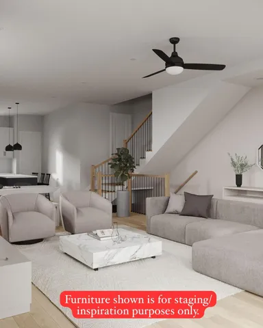 a view of staircase with white walls and a window