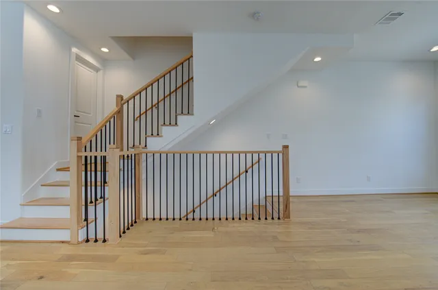 a view of living room with furniture and mirror