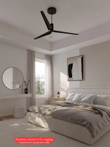 a bedroom with a bed and mirror