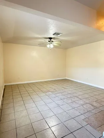 a view of a room with an empty space and a sink