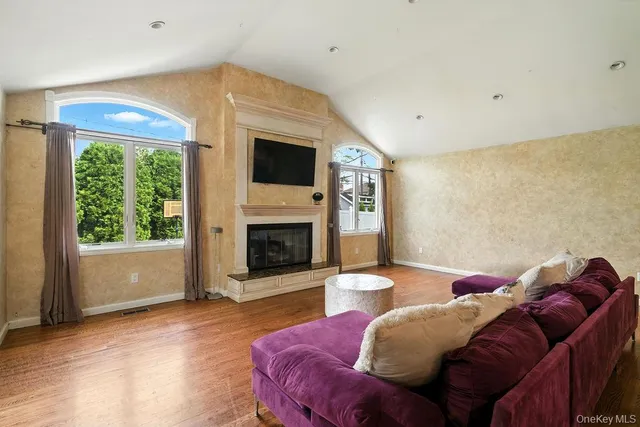 a living room with furniture and a fireplace